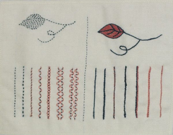photo of leaves and lines embroidered with a variety of textured embroidery stitches on linen fabric
