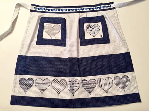 photo of an apron with blue embroidery