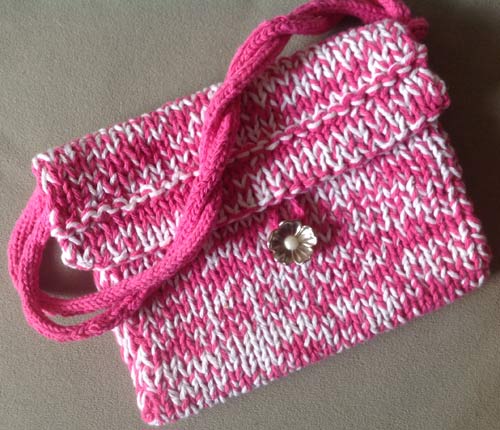 photo of a pink and white knitted pouch