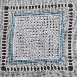 Photo of a square embroidery with a border of open squares made by removing some threads and wrapping others, with a central area of a textured grid made by stitches puling the threads of the fabric intoa pattern of smaller squares with each corner open.