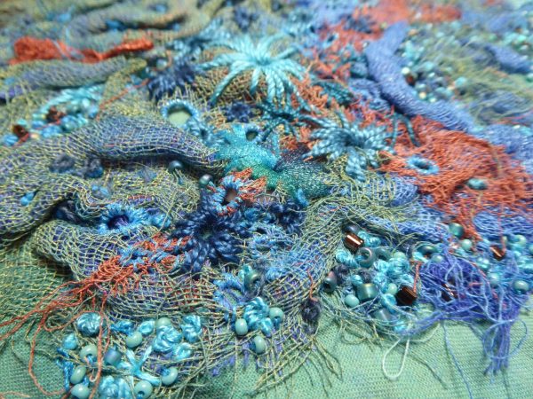 A detail photo of a multi-media embroidery designed and stitched by Barbara Gilbert.