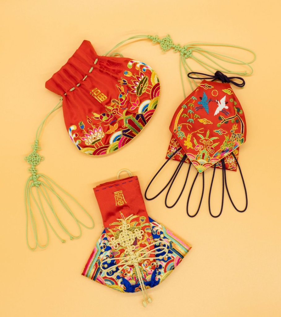 Photo of three pouches embroidered in the traditional Korean style.