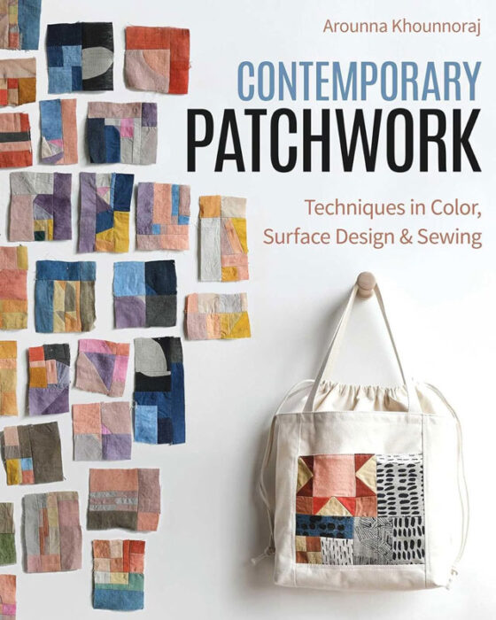 A photo of a book cover titled Contemporary Patchwork: Techniques in Colour, Surface Design & Sewing by Arounna Khounnoraj with pieces of fabric stitched together hanging on a wall and a tote bag with some of the fabric on the front.