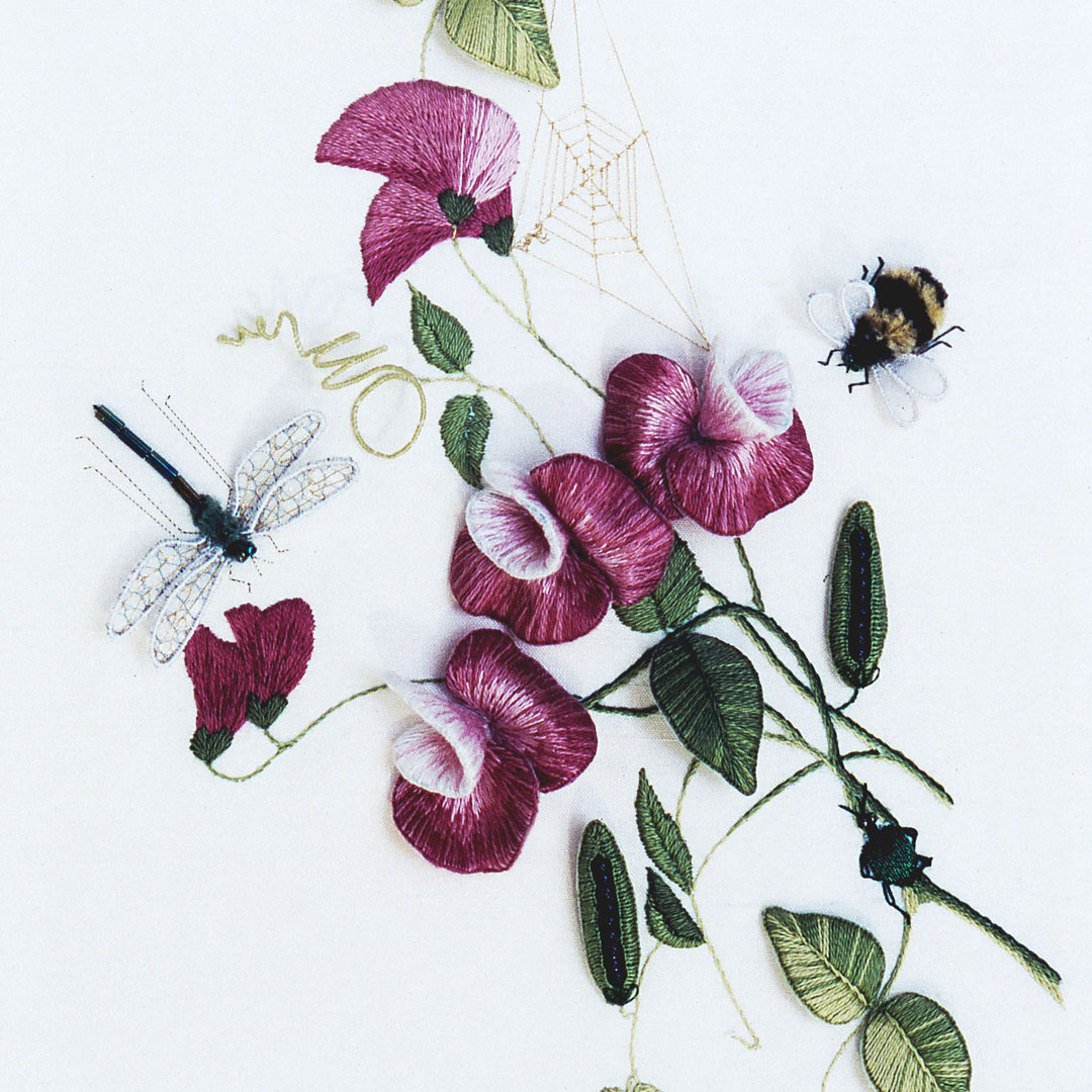 Details of a dimensional embroidered sweet peas with a dragonfly and bee.