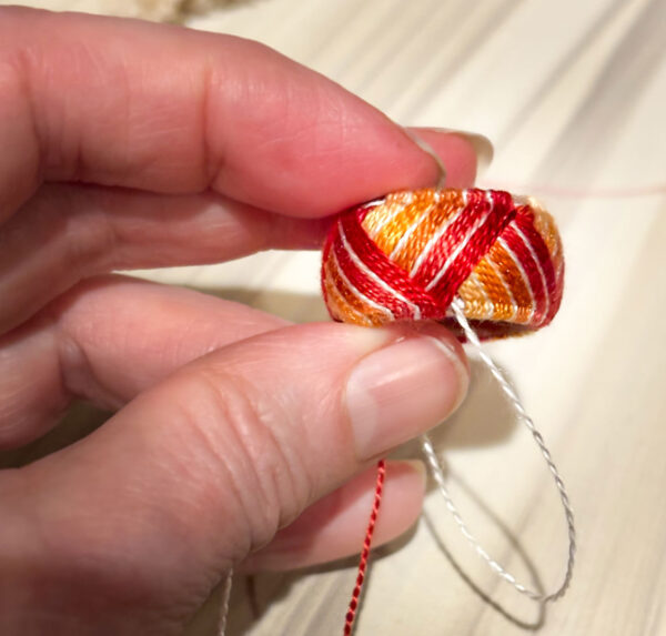 Photo of a close up of the yubinuki thimble stitching sequence.